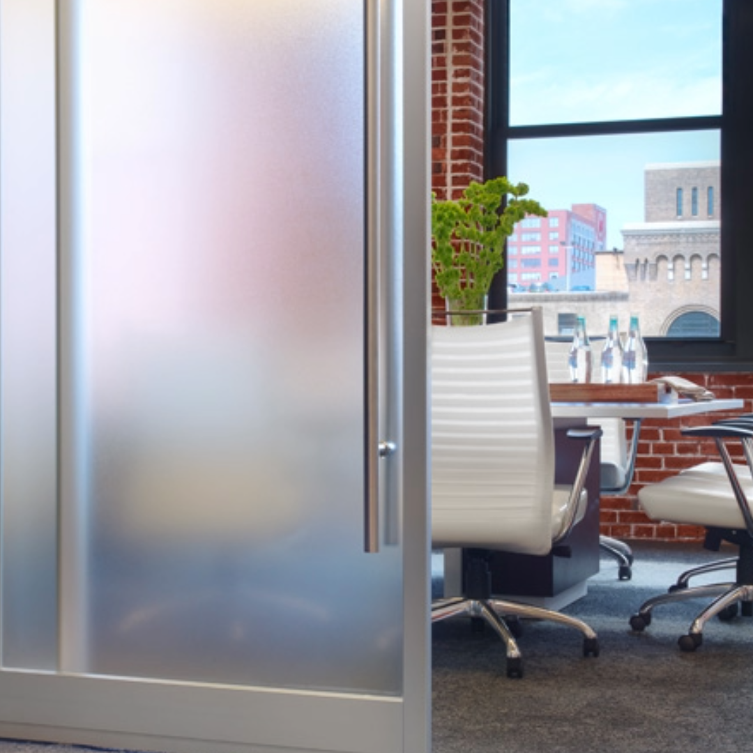Interior view of a glass door fitted with commercial window tinting film.