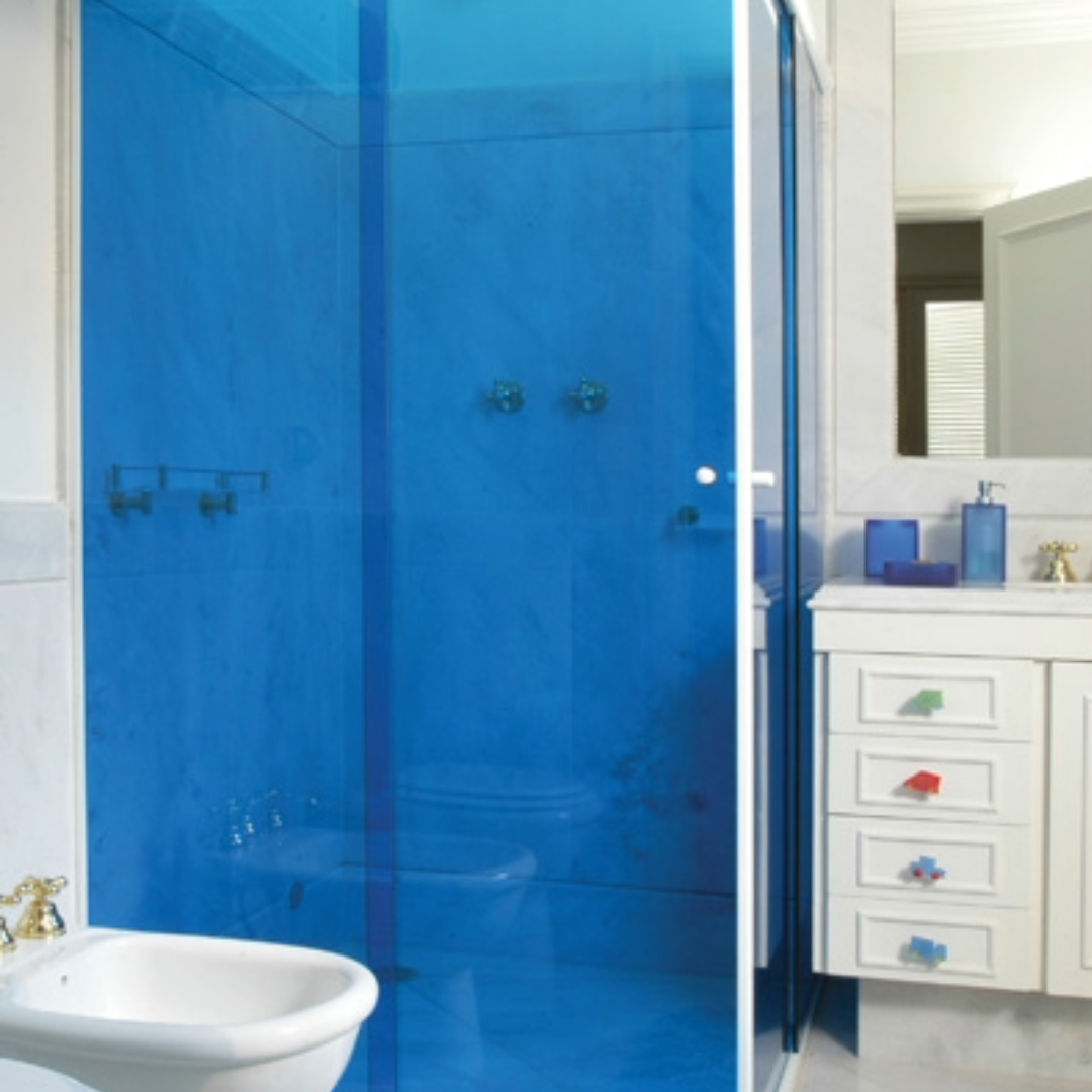 Decorative residential window tint film in a blue home shower area, enhancing style and design.